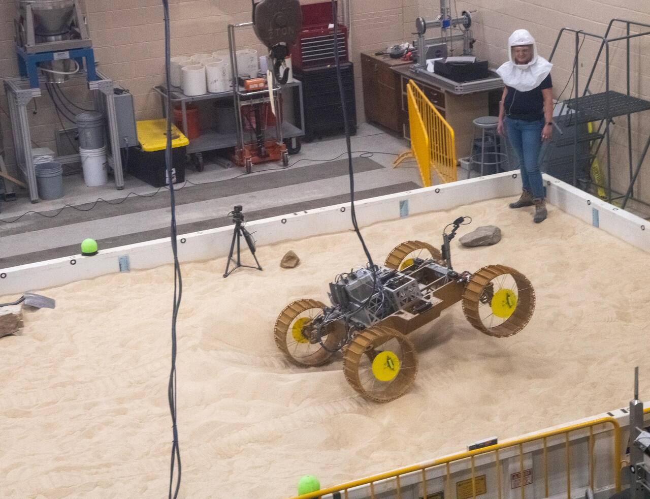 VIPER mobility testing in the SLOPE laboratory at NASA GRC, March 2021, on a GRC-1 soil bin with scattered rocks.