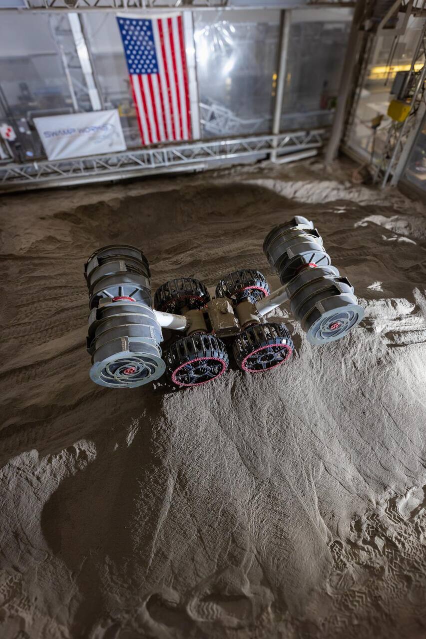 RASSOR manipulating simulated regolith to build a three-foot berm during a site preparation test in the Granular Mechanics and Regolith Operations Lab at NASA KSC, 3 June 2025