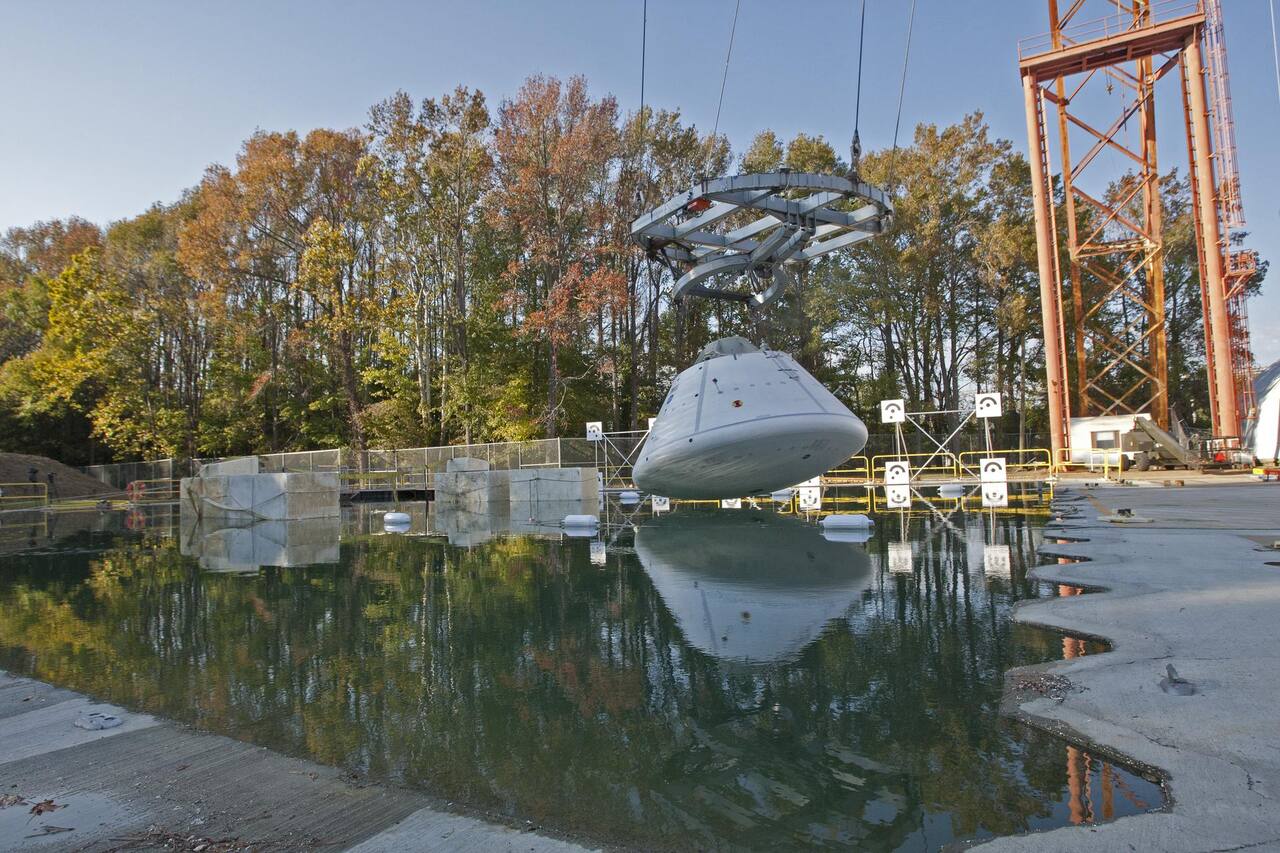 An Orion boilerplate test article at the Hydro Impact Basin at NASA LaRC during the first test of Phase 1, October 2011.