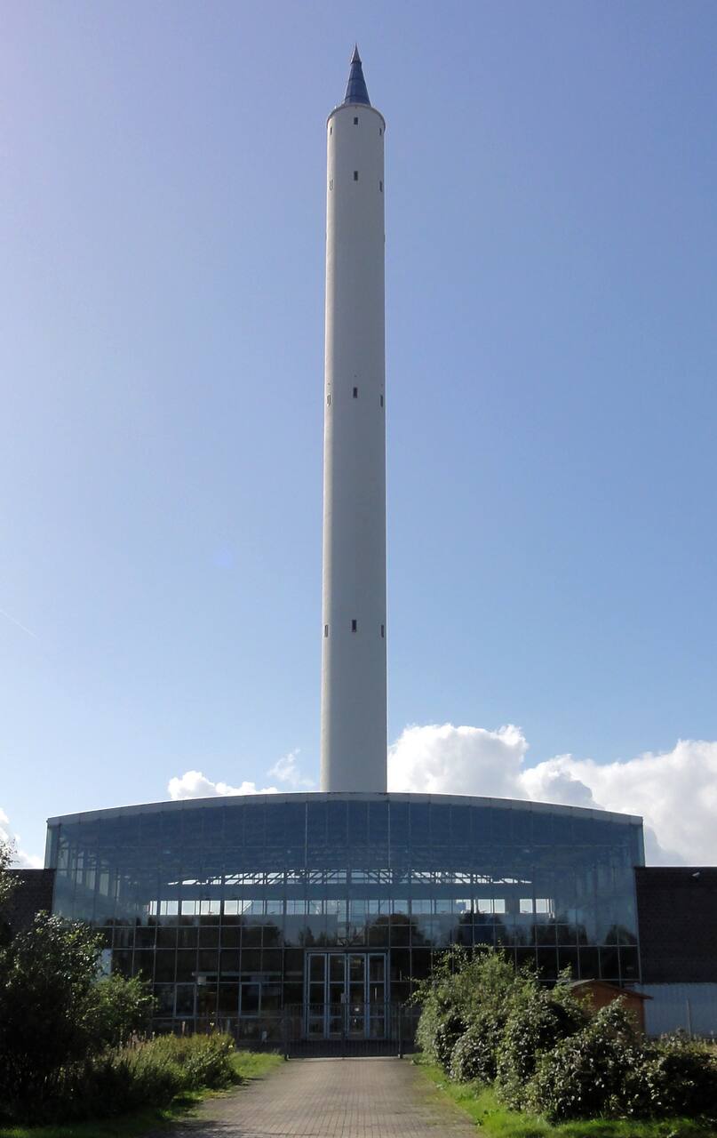 The Bremen drop tower in 2011. The 146 m concrete shell, 8 m in diameter, encloses the 120 m drop tube.